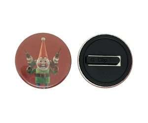 Front and back view of a 38mm Kidsafe Button Badge featuring a smiling elf holding two drills on a red background, with a black metal clasp on the back.