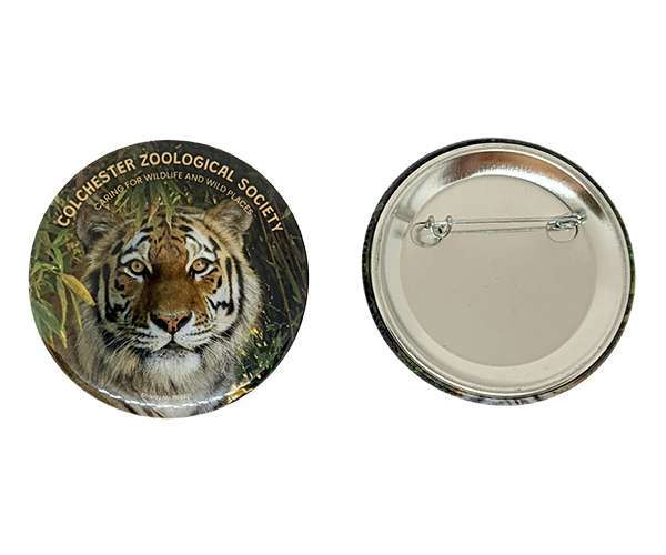 Two 58mm Button Badges: one displays a tiger and the text "Colchester Zoological Society," while the other shows the back with a safety pin fastening.