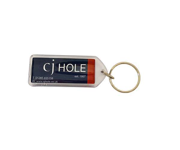 Acrylic Keyrings - 50mm x 20mm Lozenge with a metal ring, featuring the text “CJ HOLE est. 1867” on a blue and red background, along with a phone number and website.