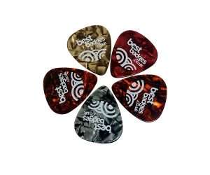 Five custom celluloid guitar plectrums from a batch of 100, each featuring the “bestbadges.co.uk” label and a white logo printed on marbled, colourful backgrounds, arranged in a circle.