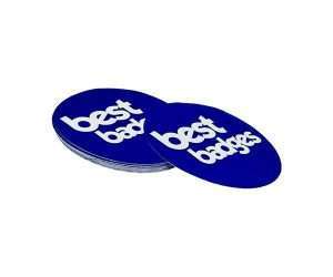 Two round blue Paper Stickers - Individually Cut, featuring the words “best” and “best badges” in bold white lowercase text, are stacked slightly overlapping on a white background.