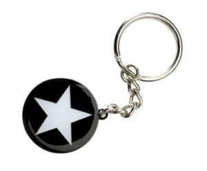 A keychain with a round black pendant featuring a white star in the center, attached to a metal keyring.
