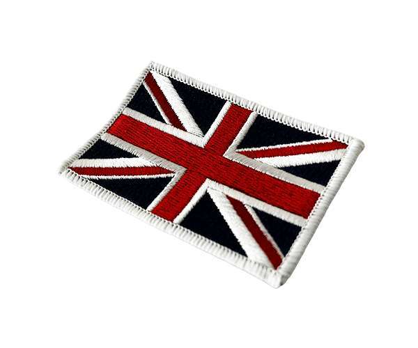 The Union Jack Flag Embroidered Badge, featuring the United Kingdom flag with a white border, is displayed on a white background.