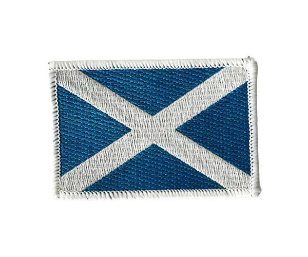 The Scotland Flag Embroidered Badge is a rectangular patch featuring the Scottish flag's distinctive white saltire on a blue background.