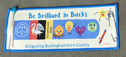 Rectangular patch reading "Be Brilliant in Bucks" with Girlguiding, swan, and cartoon icons. Text includes "Virtual Event 2021" and "Girlguiding Buckinghamshire County.