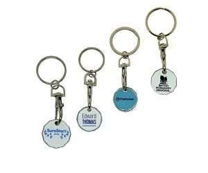 Four Printed Trolley Coins, each featuring a round tag with a different company logo and name, are arranged in a row against a white background.