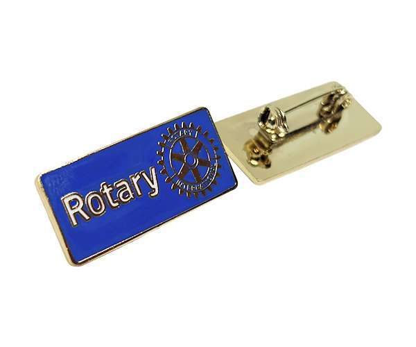 Rectangular Rotary Lapel Badges in blue and gold, featuring “Rotary” text and a gear logo on the front, displayed front and back with pin fastening.