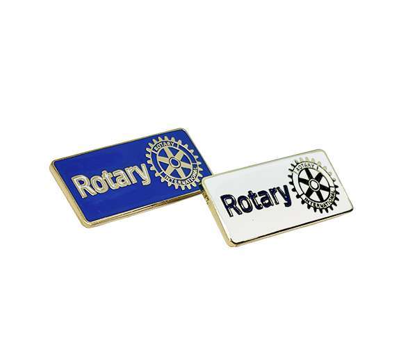 Two Rectangular Rotary Lapel Badges—one blue and one white—each featuring the Rotary logo and gear symbol.