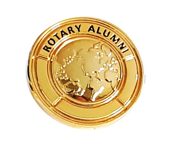 Gold pin with the text "Rotary Alumni" encircling a raised image of a world map.