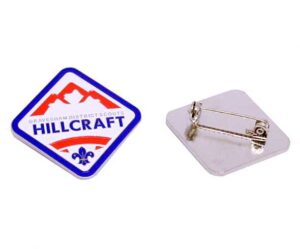 Soft enamel badge with 'Gravesham District Scouts Hillcraft' and Scouts logo in blue, red and blue design, and blue border; reverse shows brooch safety pin