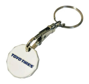 A metal keychain with a round white tag displaying the blue "TOYO TIRES" logo in capital letters.
