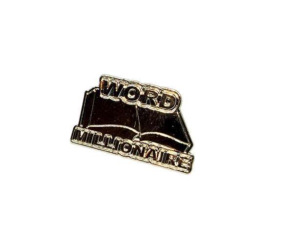 Word Millionaire Badges featuring gold pins with the words “WORD MILLIONAIRE” displayed over an open book design on a white background.