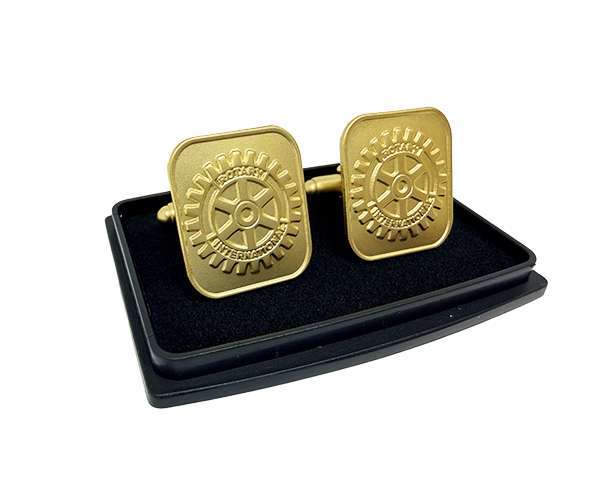 A pair of Rotary Gold Cufflinks in a presentation case, featuring a stylish gear design.