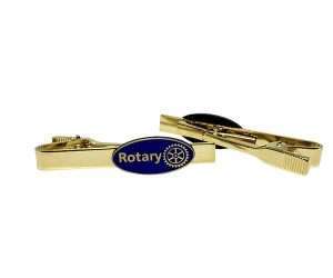 Two Rotary Oval Badges - Tie-pin in gold, each featuring a blue oval emblem with the word “Rotary” and the Rotary International gear logo.