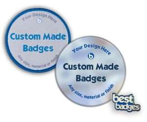 Two round Custom Made Badges, each featuring the text "Custom Made Badges" and "Any size, material or finish" along the edge. The bottom right corner displays the Custom Made Badges logo.