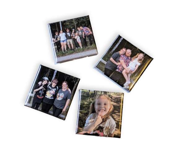 Four square photo magnets featuring group and individual outdoor family portraits, arranged on a white background.