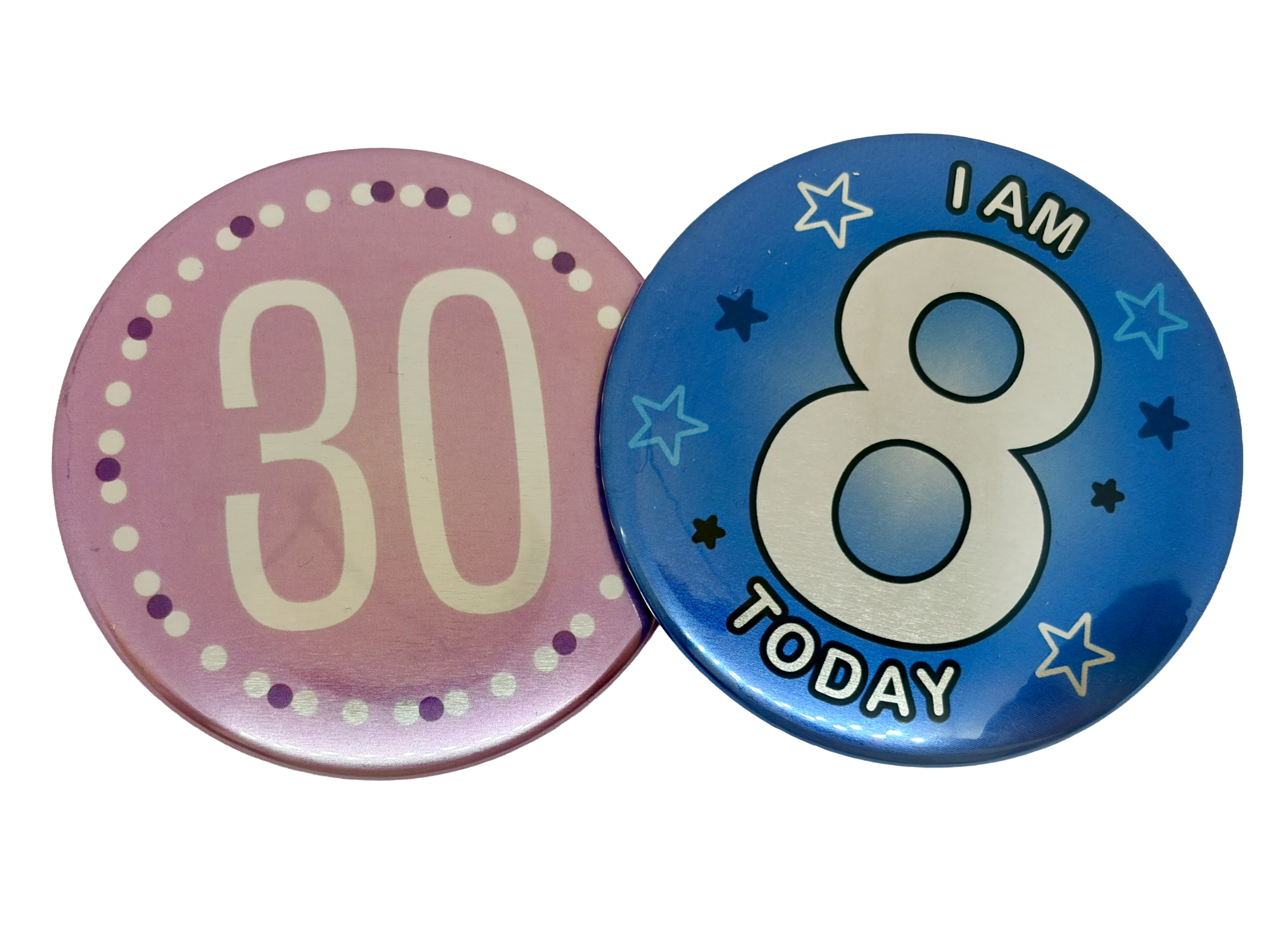 Two round Metallic Button Badges: one in purple with "30" in white, and the other in blue featuring "I am 8 today" in white surrounded by stars—perfect inspiration if you’d like to design your own Metallic Button Badge.