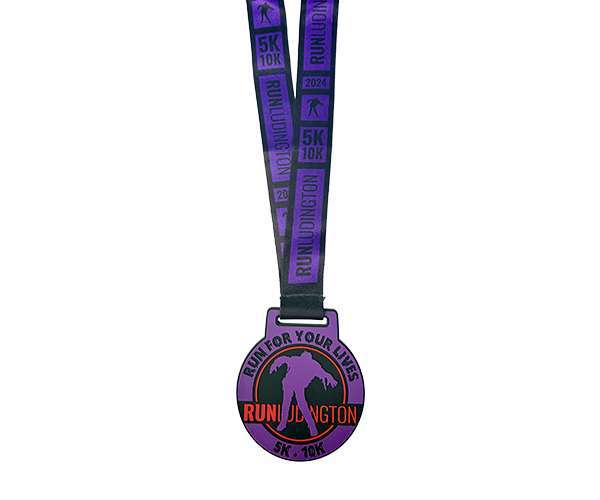 Soft PVC Medal in black and purple featuring "RUN FOR YOUR LIVES" and "RUN JUNCTION 5K-10K" text, with a silhouette of a zombie and runner on both the ribbon and the medal.