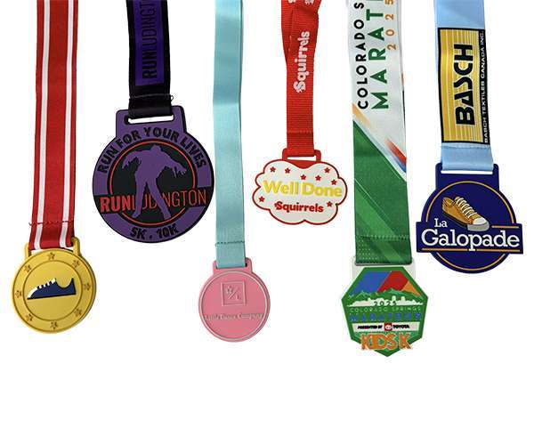 Soft PVC Medals are available in five unique designs, each featuring vibrant ribbons, custom logos, and text tailored for different running events and organisations.