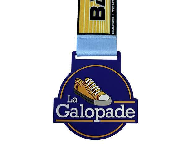A Soft PVC Medal from our collection, featuring a blue ribbon, displays a trainer illustration and the text "La Galopade" on a circular background.