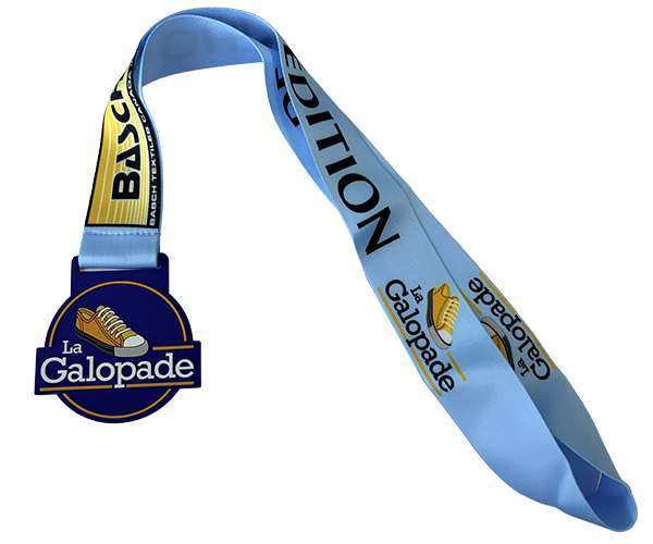 Soft PVC medal in blue featuring a yellow shoe design, complete with a matching ribbon printed with "La Galopade" and "EDITION BASC".