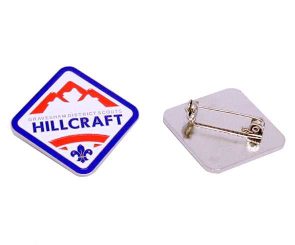 Soft enamel badge with 'Gravesham District Scouts Hillcraft' and Scouts logo in blue, red and blue design, and blue border; reverse shows brooch safety pin